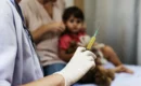 A child is getting ready for child vaccination schedule in jaunpur.